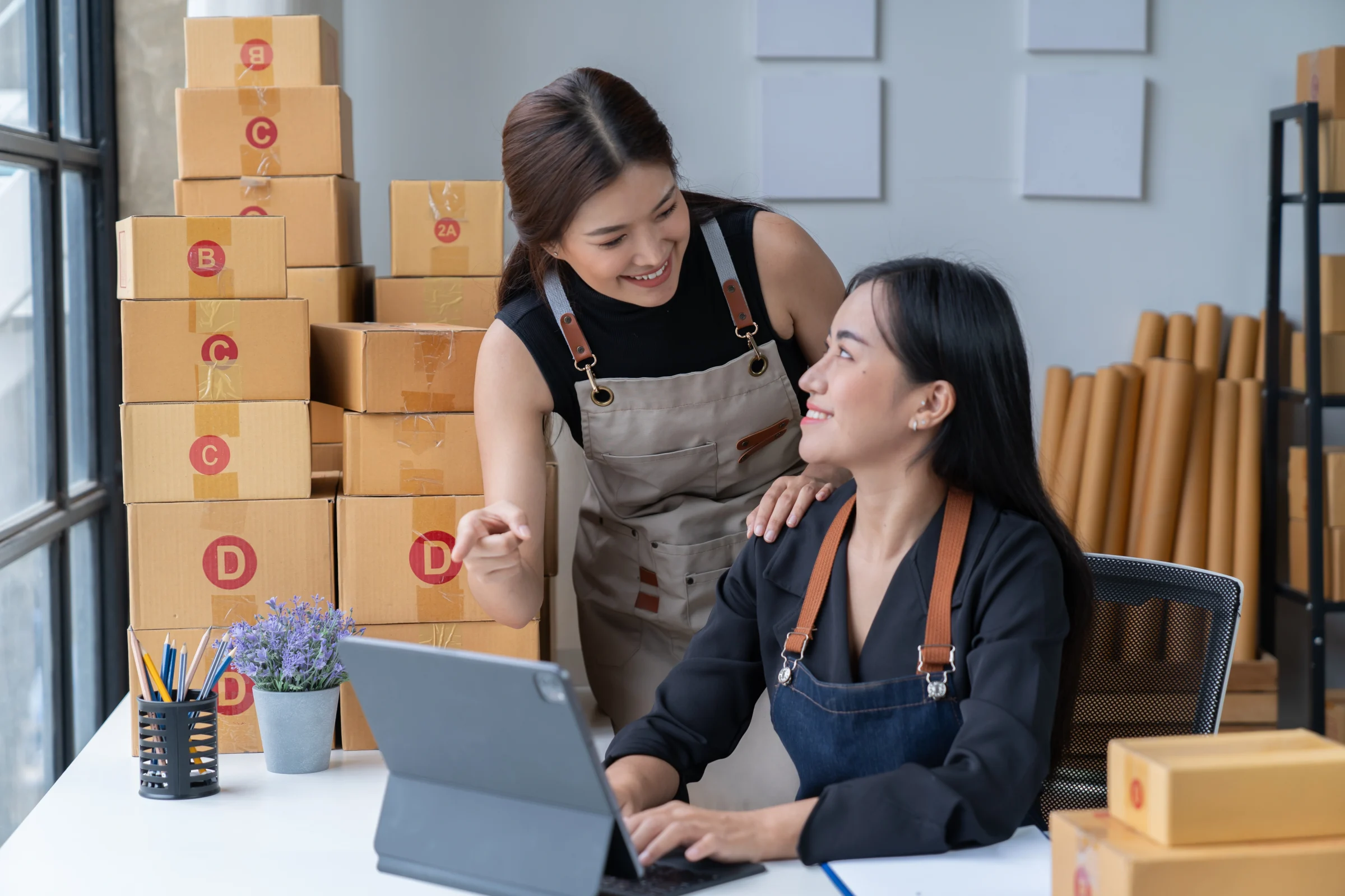 Two women deliberate together on how long to keep records.