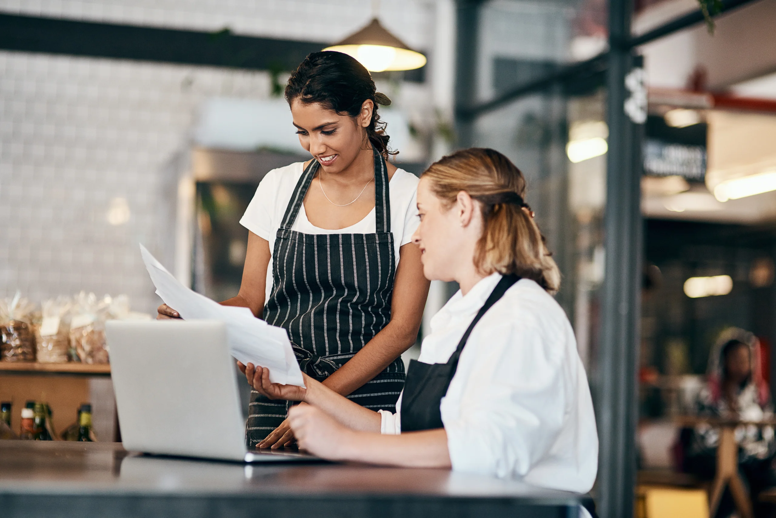 Two women share Essential Insights, Applications and Developments on Liquidity.