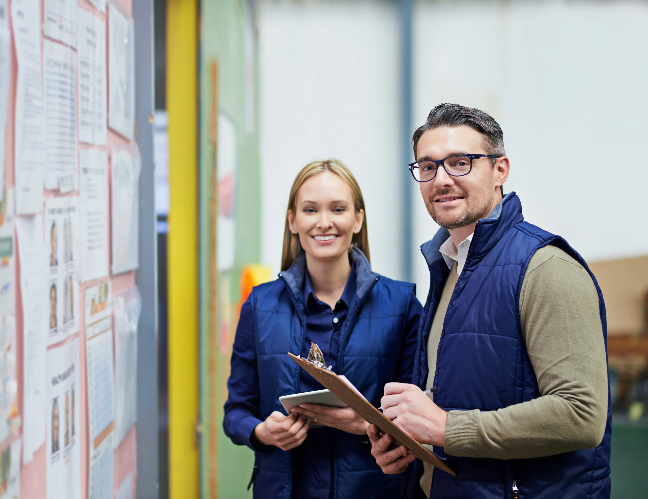 A man and a woman discuss the progress of their organisation's KPIs together.